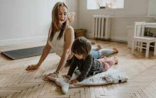 mother doing yoga with child