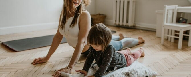 mother doing yoga with child