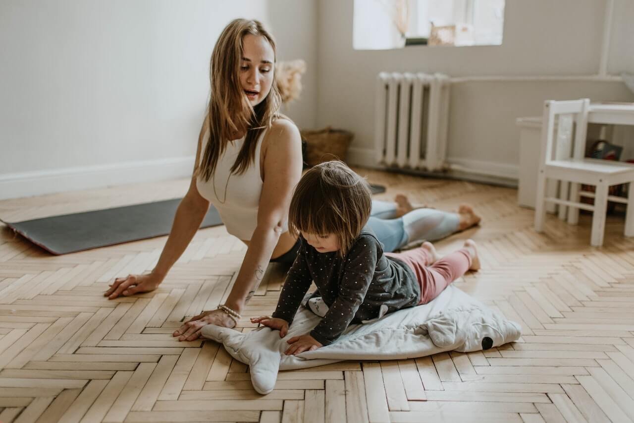 mother doing yoga with child